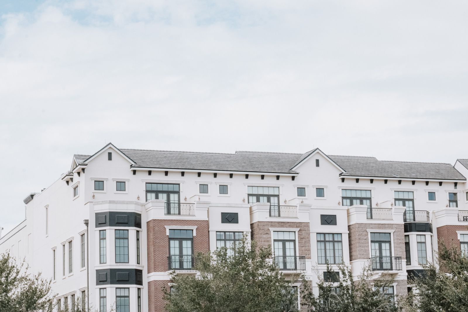 A multi-story residential apartment building exterior.